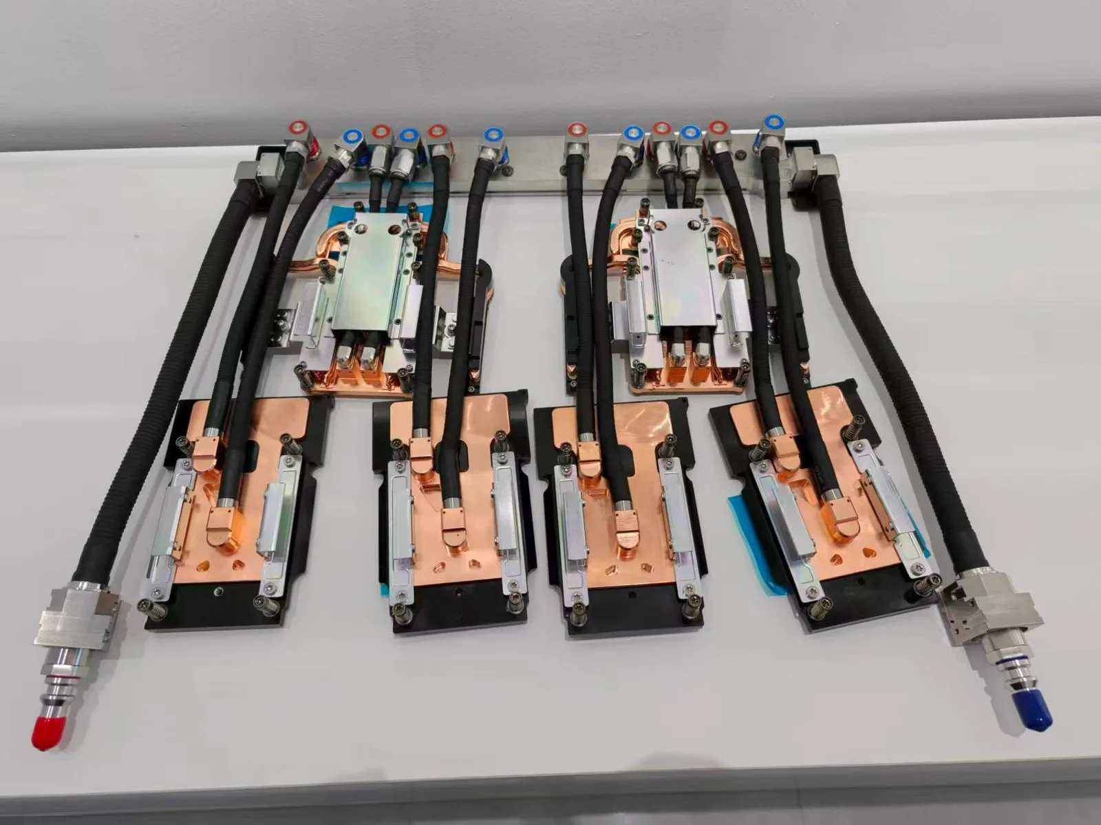 ToneCooling GB300 4G+2C liquid cold plate kit with four GPU cold plates, two CPU cold plates, manifold, hoses and red and blue quick disconnects